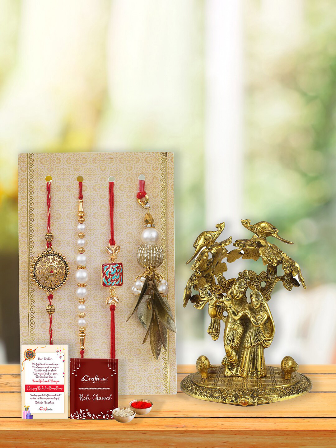 eCraftIndia Set of 4 Rakhi with Roli Chawal & Radha Krishna Statue Greeting Card Gift Set