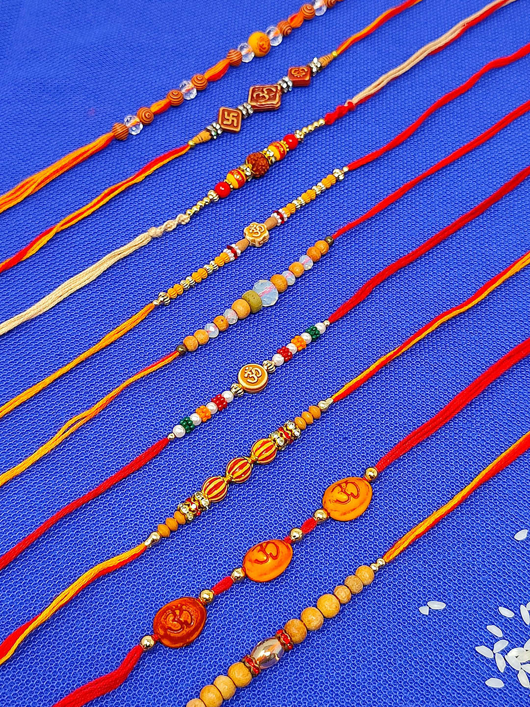 CRAYTON Set of 9 Beaded Rakhi With Roli Chawal Holder