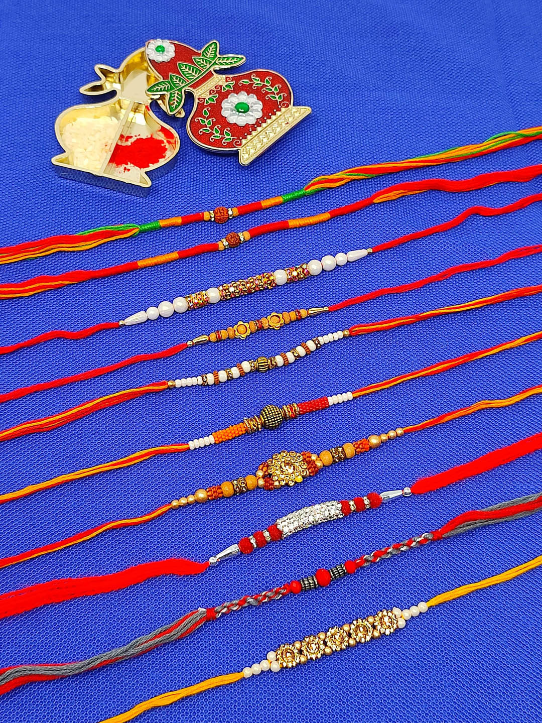 CRAYTON Men Set Of 10 Rakhi With Roli Chaval Holder