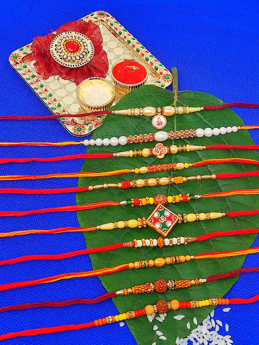 CRAYTON Set of 11 Rakhi with Roli Chawal & Small Plate