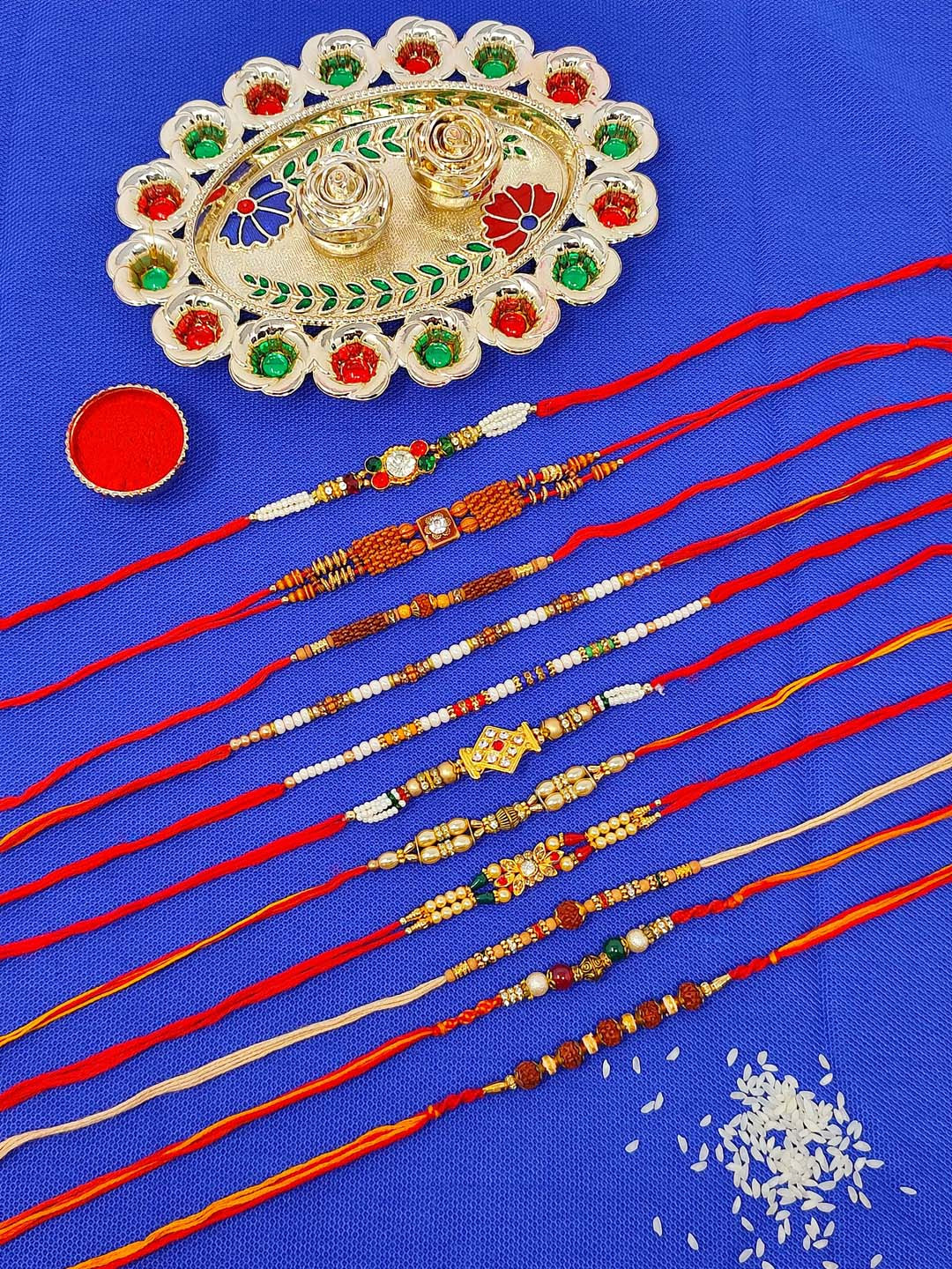 CRAYTON Set Of 11 Modern Yet Traditional Beaded Thread Rakhis With Roli Chawal