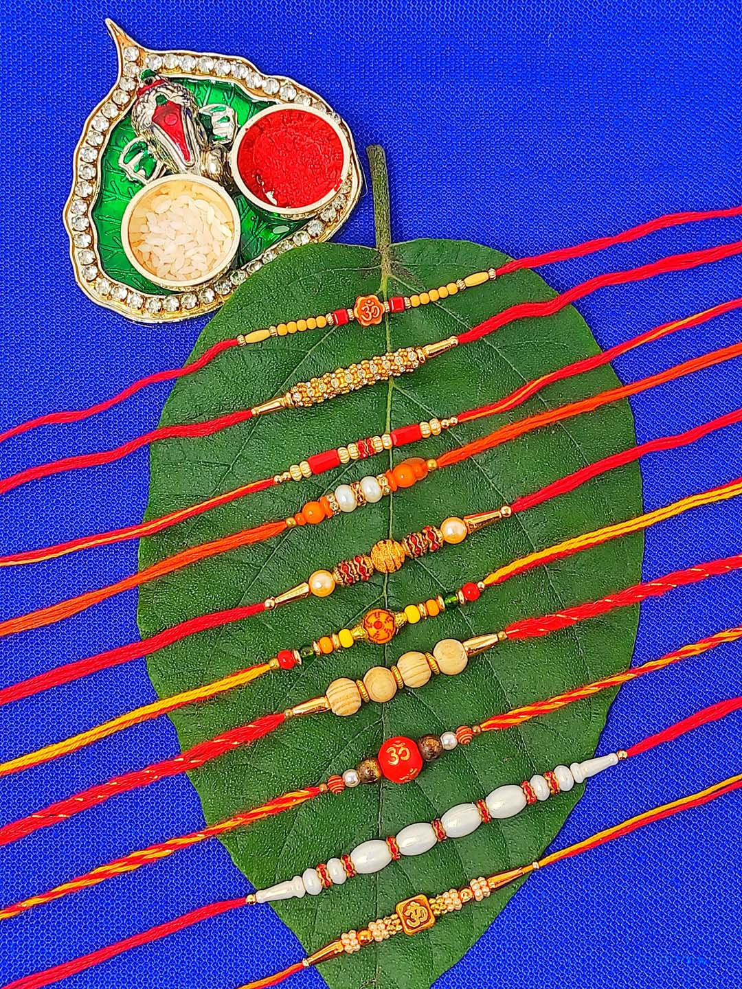 CRAYTON Men Set Of 10 Rakhis With Roli Chaval Holder