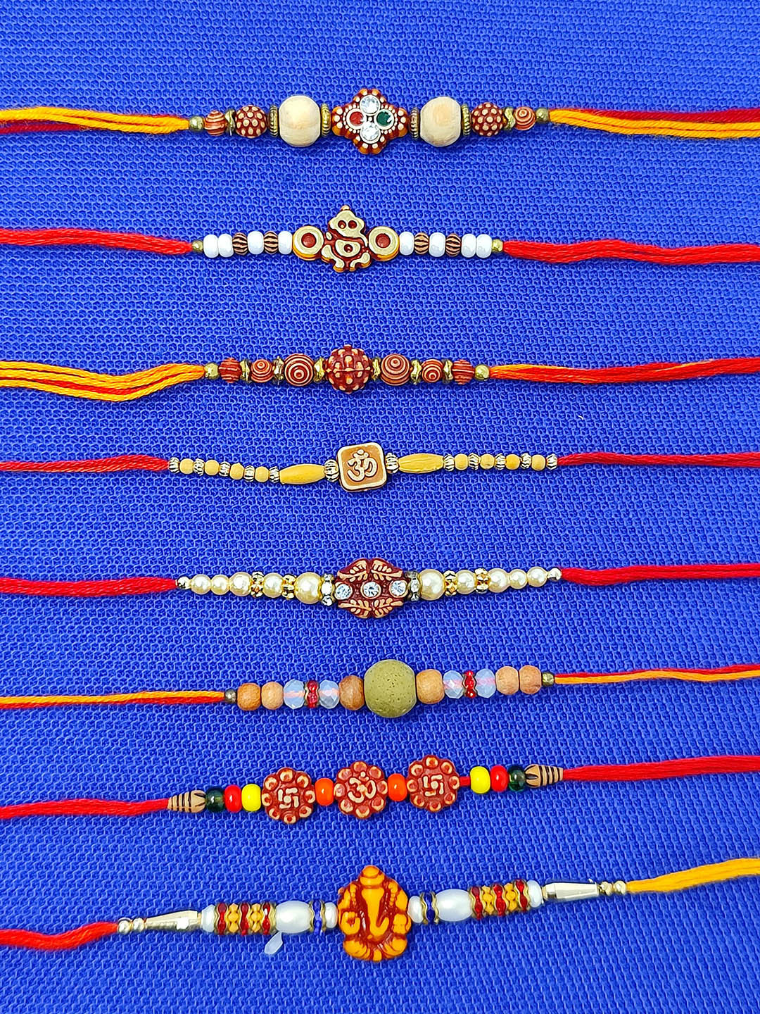 CRAYTON Set Of 8 Modern Yet Traditional Beaded Thread Rakhis with Roli Chawal & Box