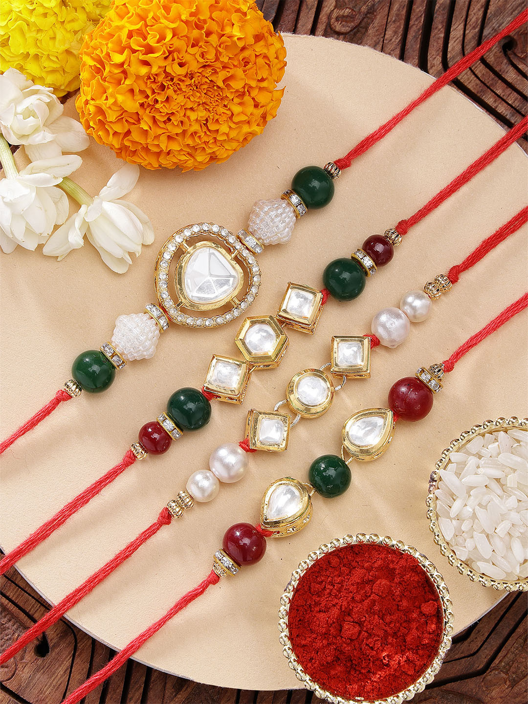 KARATCART Set of 4 Gold Plated Polki Kundan-Studded Rakhi With Roli Chawal & Greeting Card
