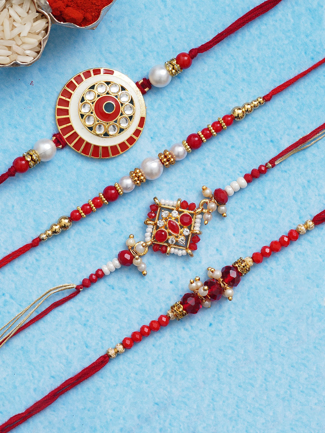eCraftIndia Set of 4 Red & Golden Beads & Pearls Designer Rakhis With Roli Chawal Pack