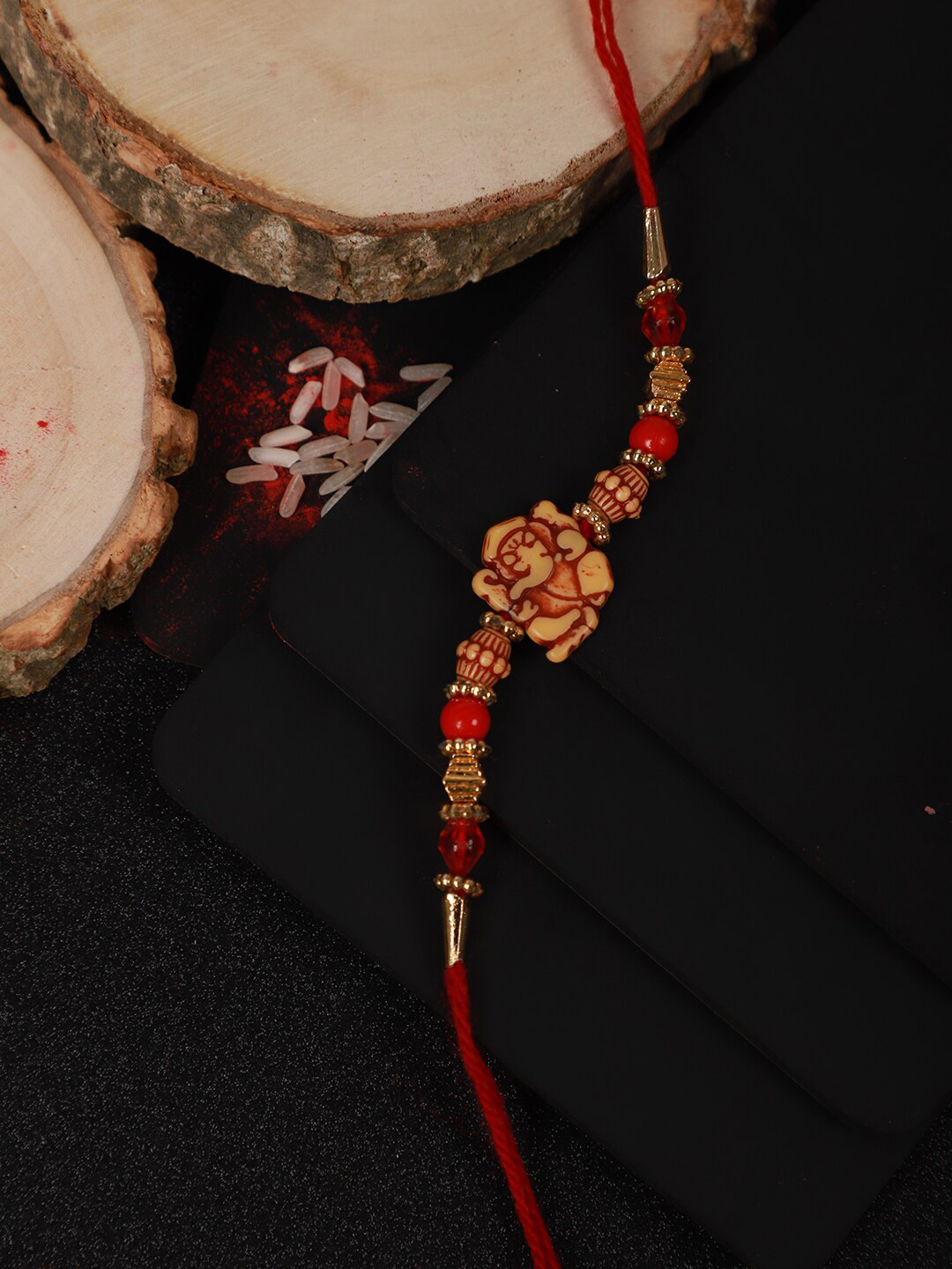 Anouk Ganesh Charm Rakhi & Greeting Card & Roli Rice Gift Set