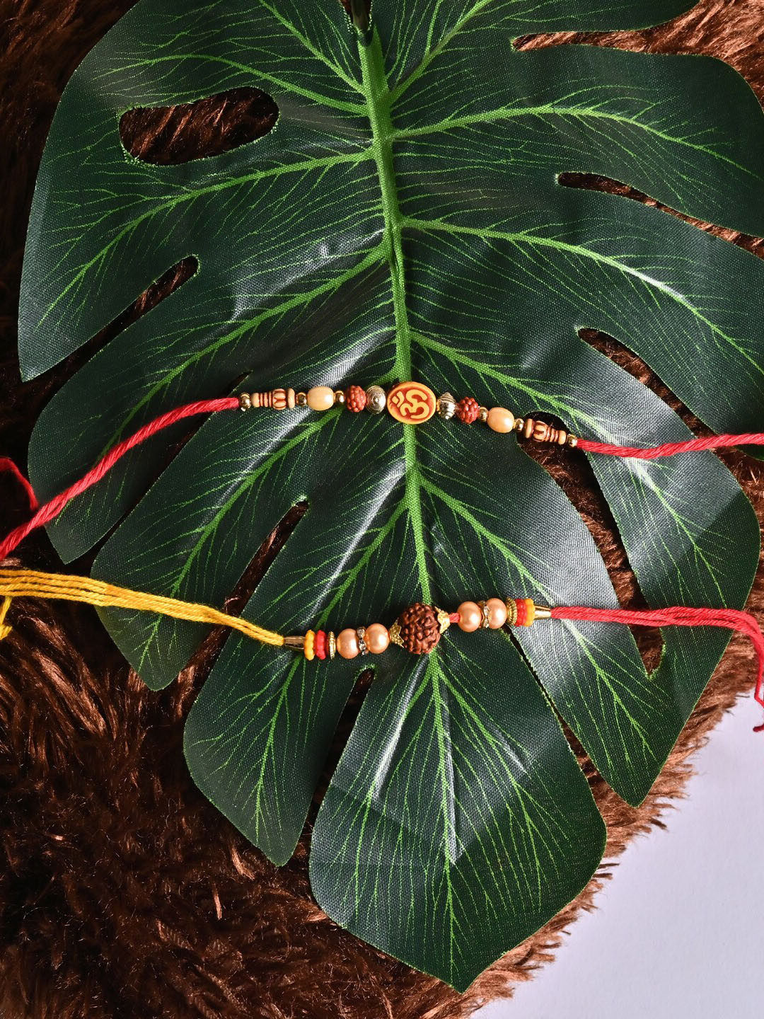 Jewelz Unisex Set Of 2 Om & Rudraksh Charm Rakhi