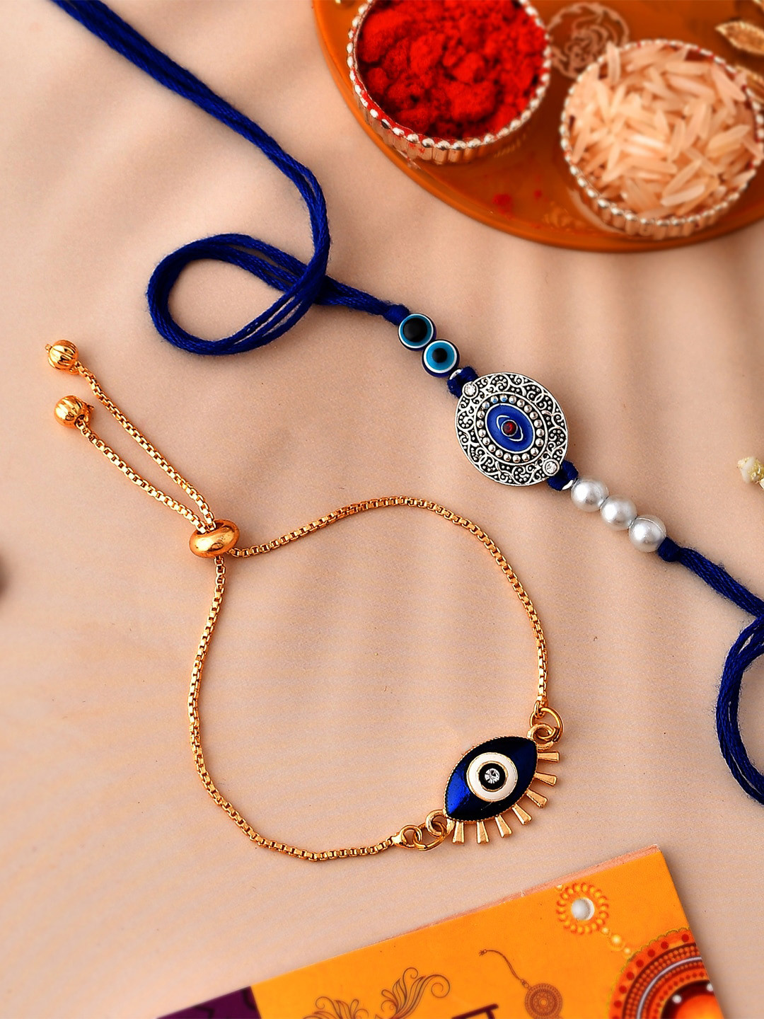 CraftVatika Set Of 2 Evil Eye Charm Rakhi With Roli Chawal