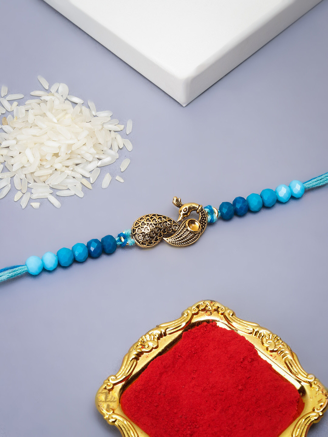 The Purple Tree Peacock Charm Rakhi