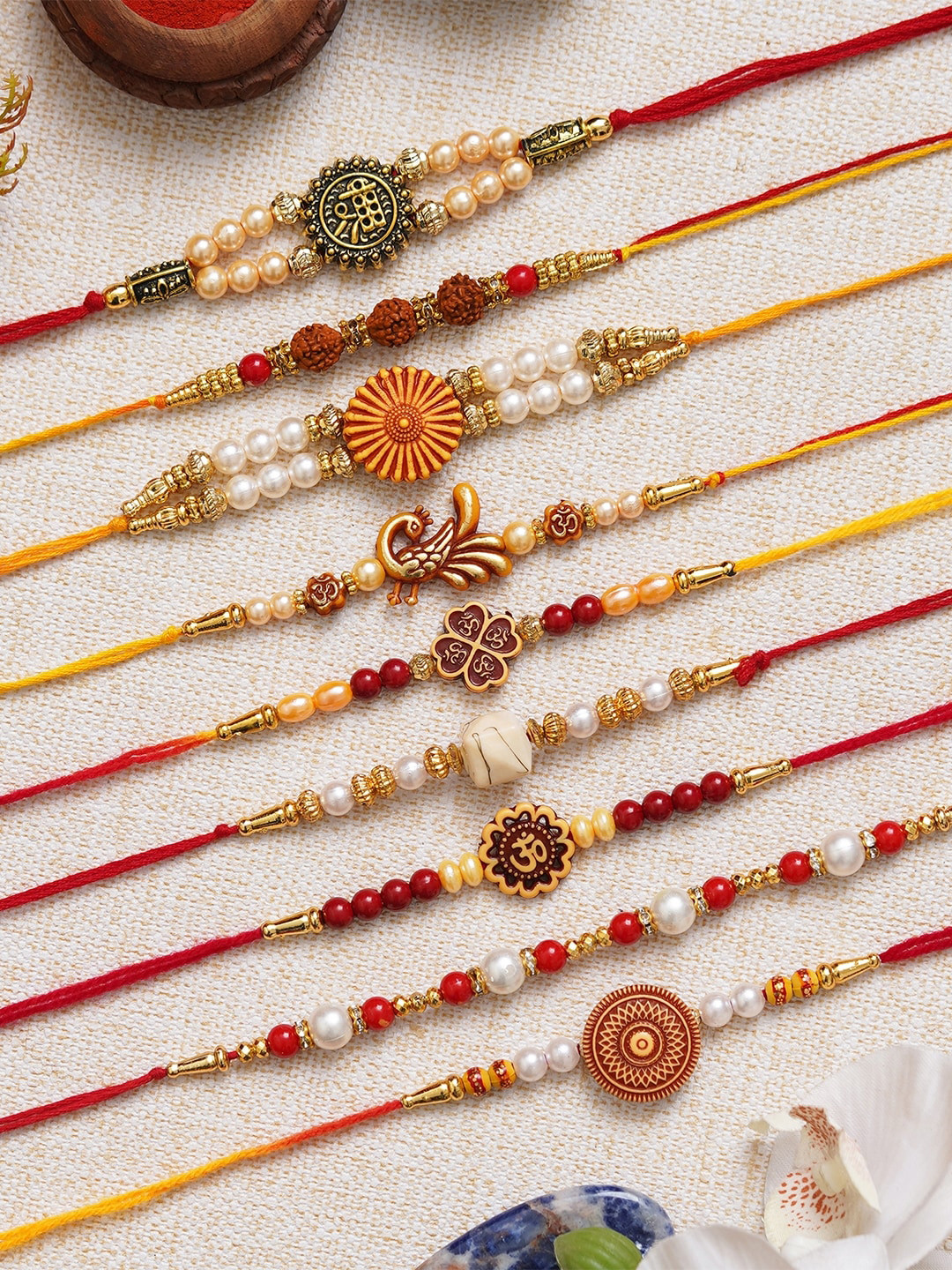 eCraftIndia Set of 9 Shri Rudraksha Flower Peacock Om & Beads Rakhis With Roli Chawal
