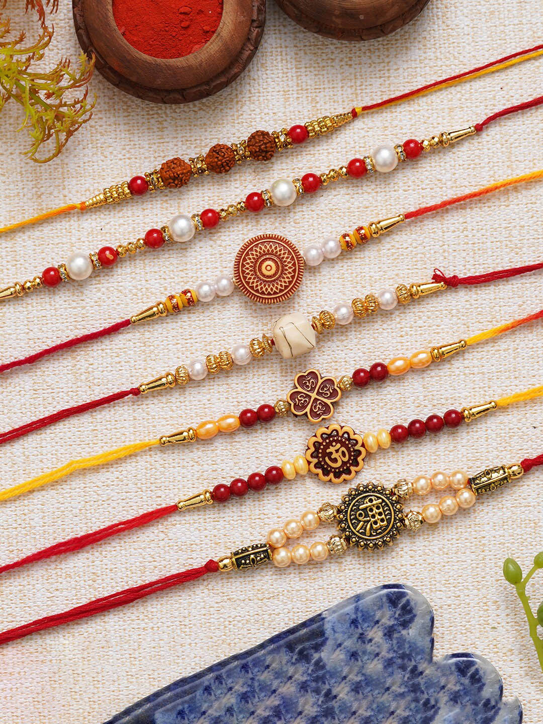 eCraftIndia Set of 7 Rudraksha Pearls Om Shri Religious Rakhis With Roli Chawal