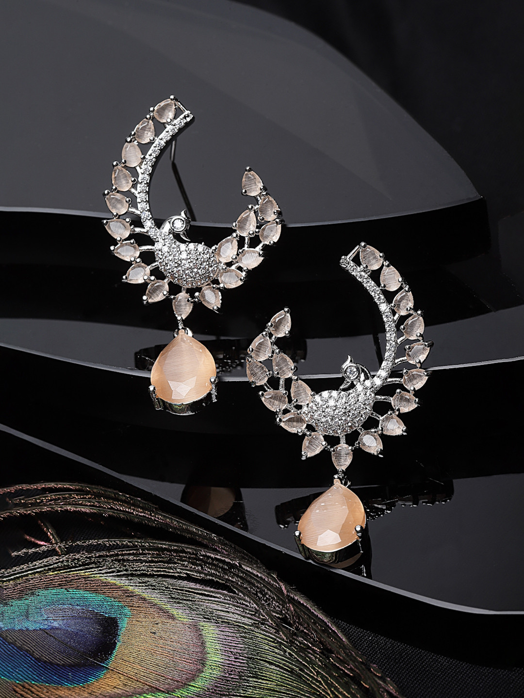 Rhodium-Plated Orange American Diamond Studded Peacock Shaped Drop Earrings
