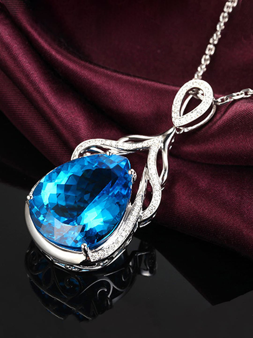 Designs & You Silver-Plated AD-Studded & Ice Cut Blue Teardrop Shape Pendant With Chain