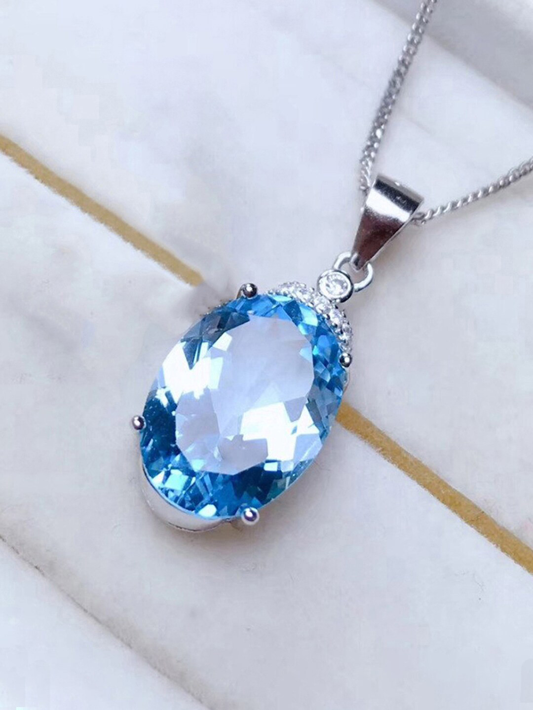 Designs & You Silver-Plated AD-Studded & Ice Cut Blue Oval Shape Pendant With Chain