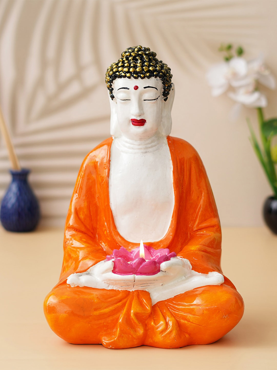 eCraftIndia Meditating Buddha with Lotus Flower in Hands Tea Light Holder Orange Polyresin Glossy Living Room Hand-Crafted Medium Showpiece - 13.4 Inches