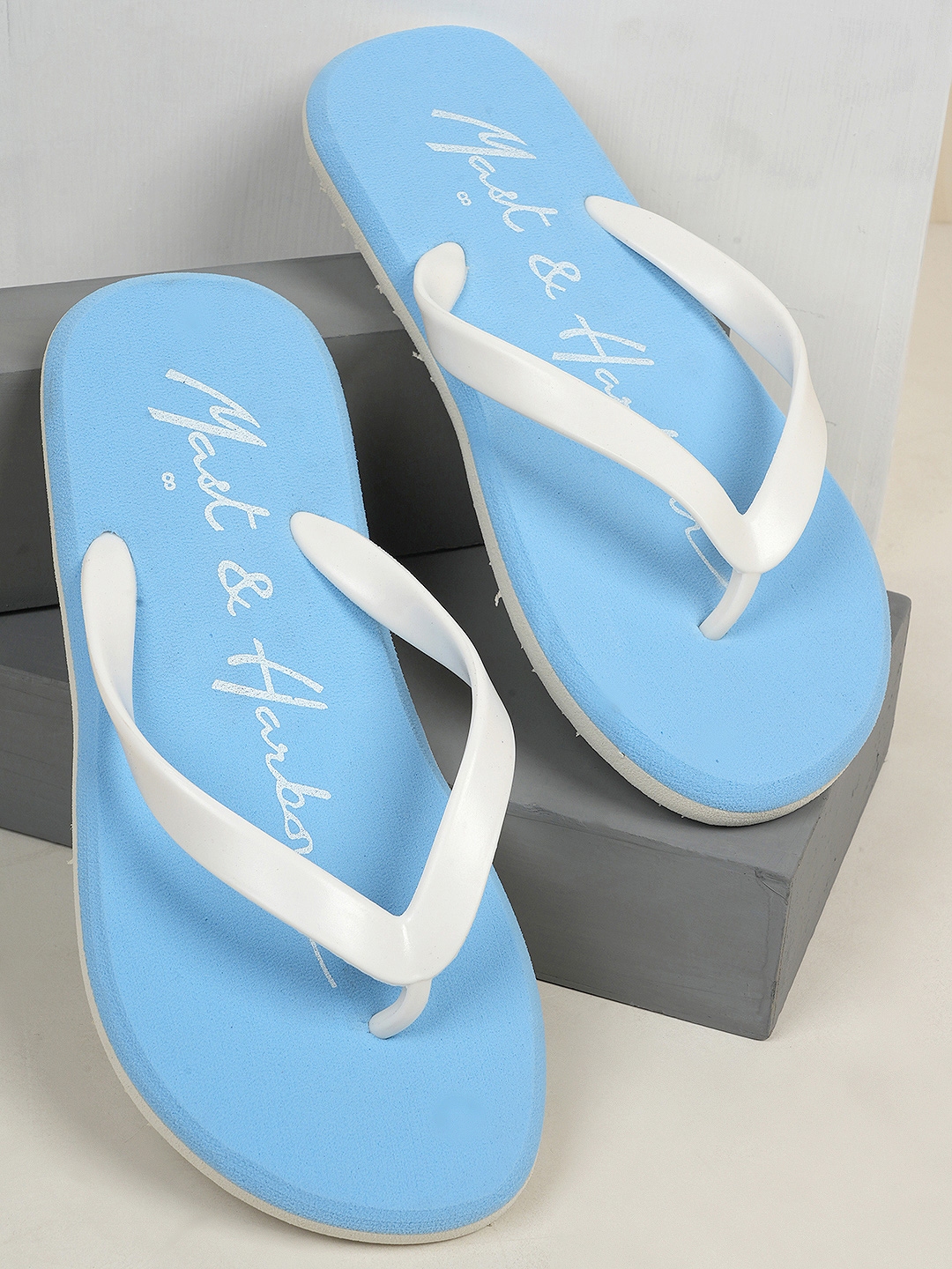 Blue and 2025 white flip flops