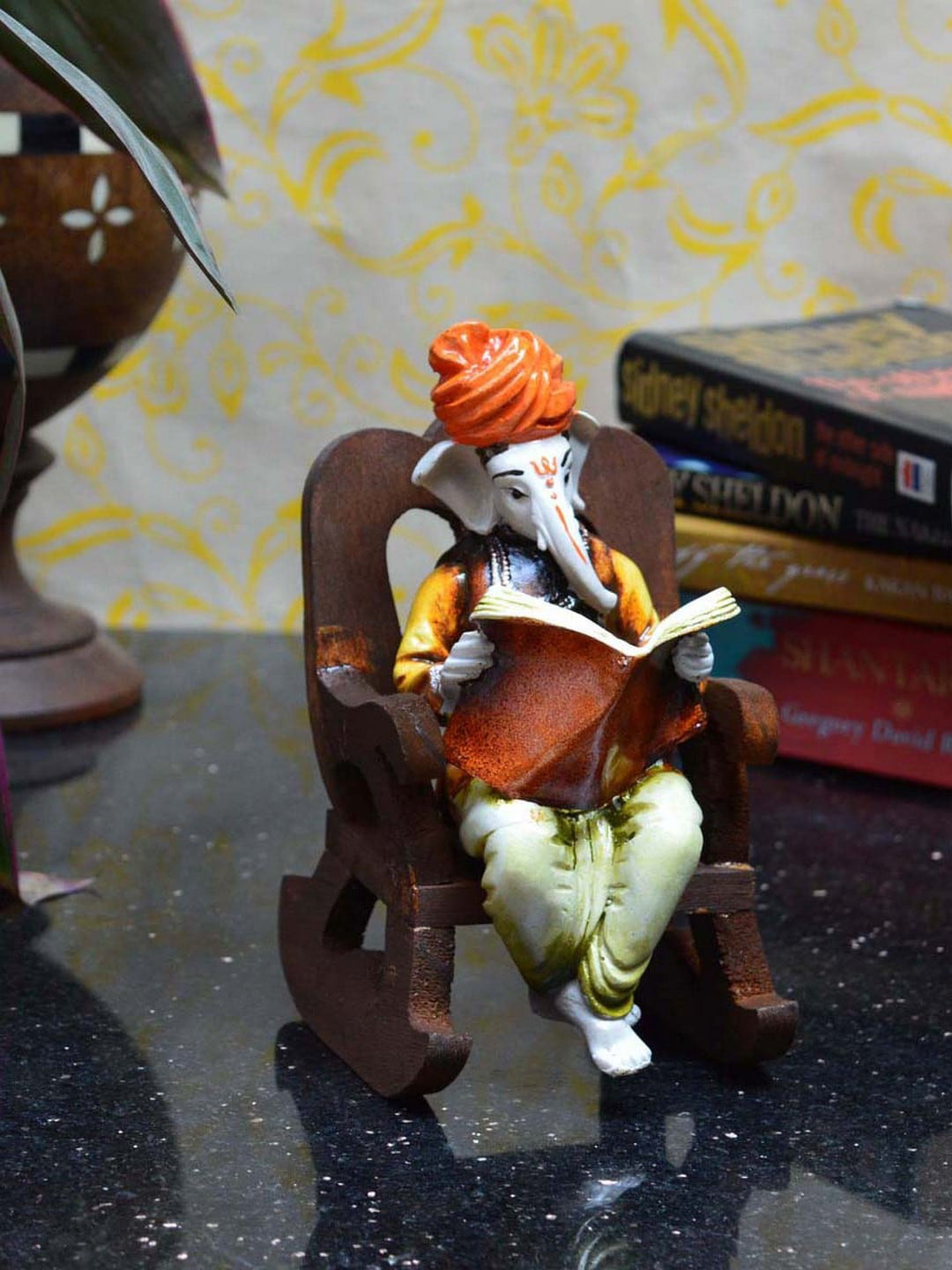 eCraftIndia Lord Ganesha Reading Book on Chair Orange Polyresin Glossy Prayer Room Medium Showpiece - 6.3 Inches
