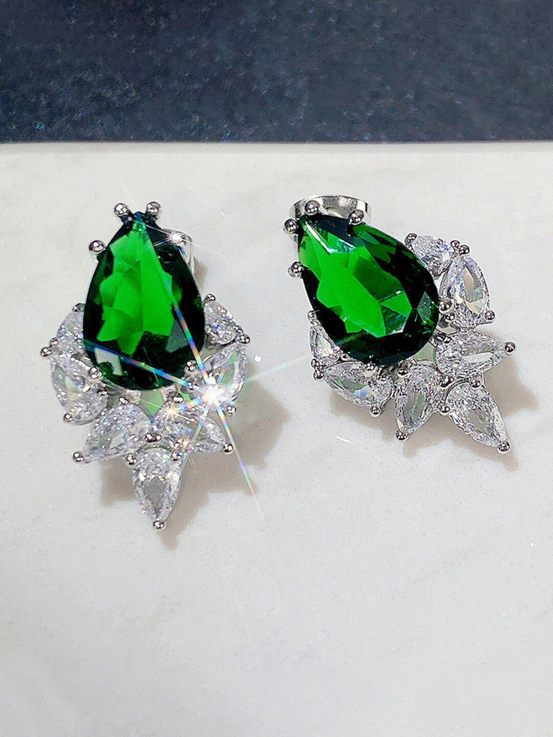 Designs & You Silver-Plated American Diamond Studded Teardrop Shaped Earrings