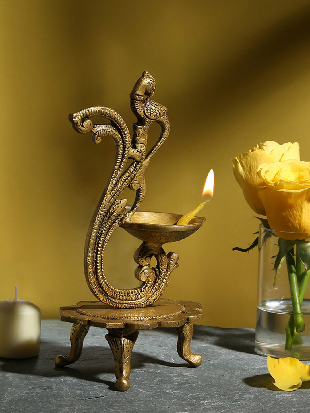 Two Moustaches Gold-Toned Curved Peacock Design Brass Diya