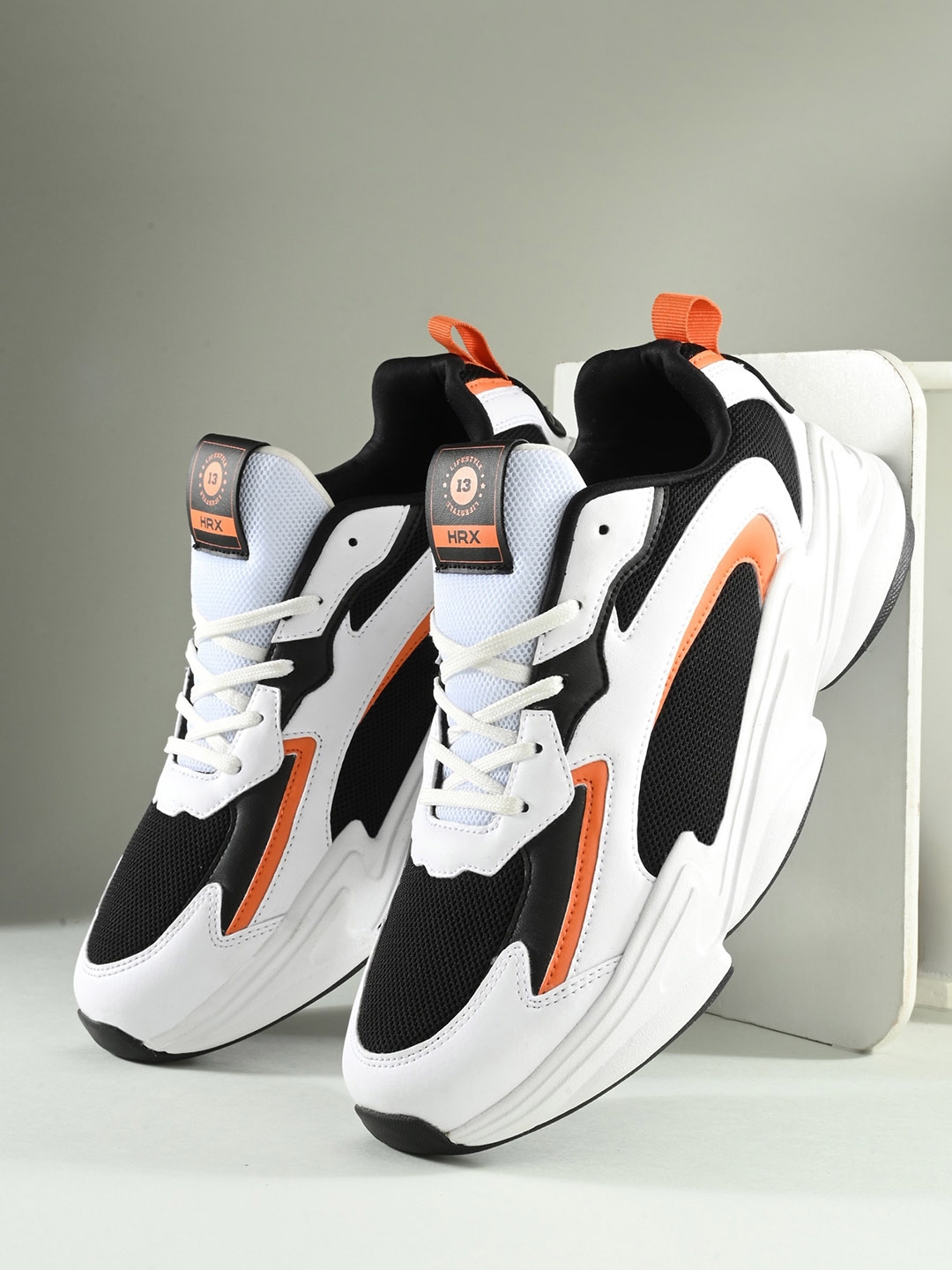 Nike white best sale and orange shoes