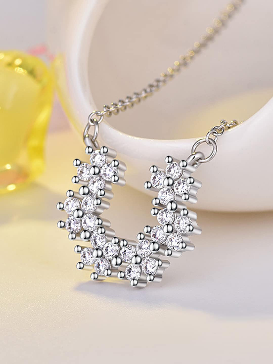Jewels Galaxy Silver-Plated AD-studded Half Hoop Floral Pendant With Chain