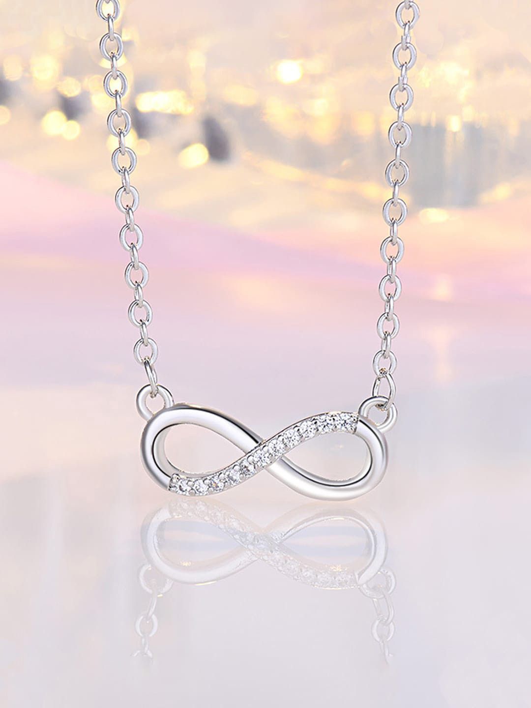 Jewels Galaxy Silver-Plated AD-Studded Infinity Shaped Pendant With Chain