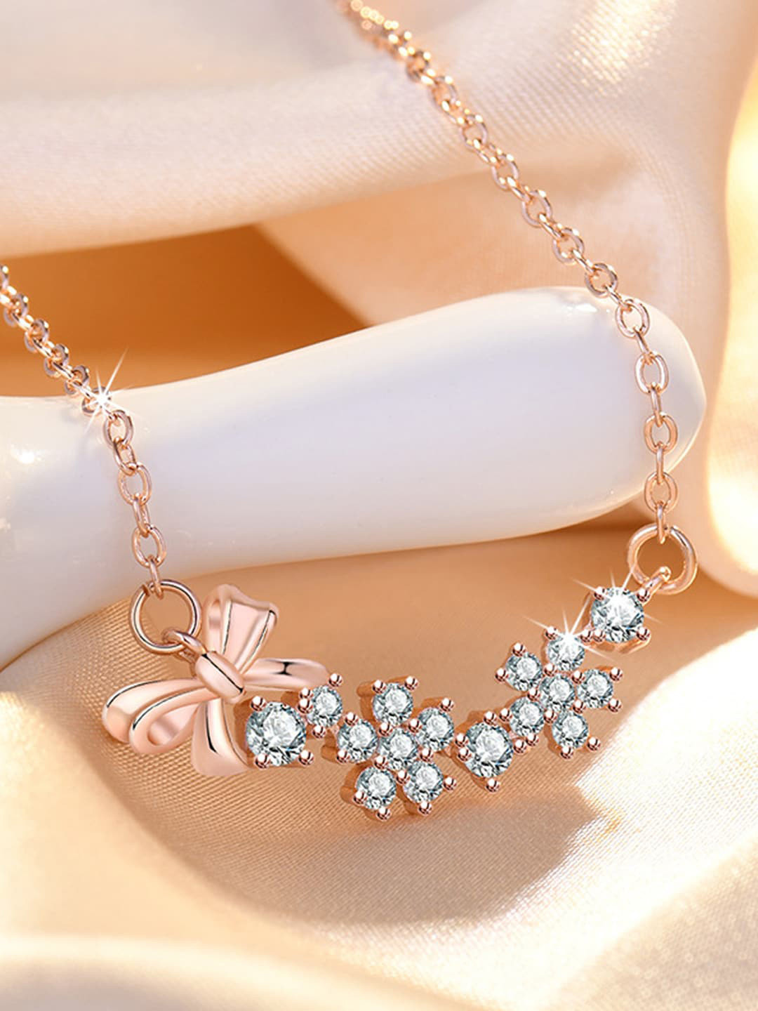 Jewels Galaxy Rose Gold-Plated AD-Studded Bow-Tie Themed Pendant With Chain