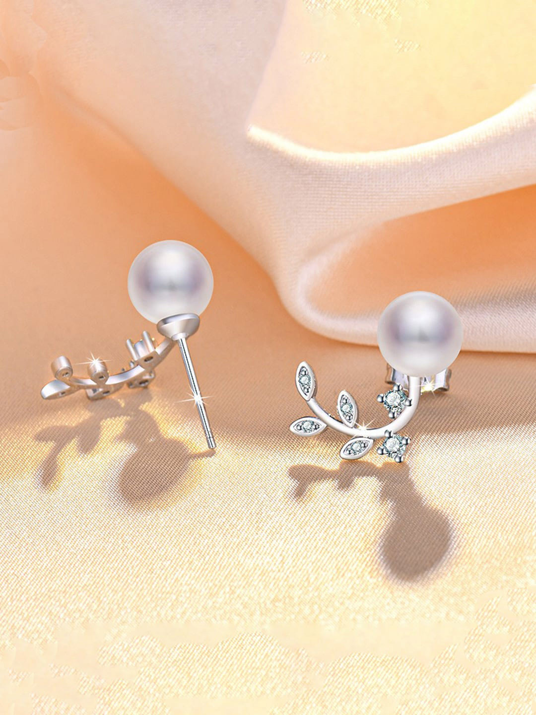 Jewels Galaxy Silver Plated American Diamond Studded Pearl Leaf Stud Earrings