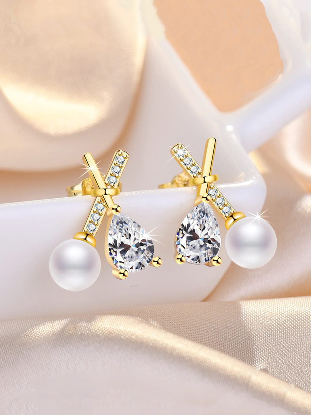 Jewels Galaxy Gold Plated American Diamond Studded Cross Shape Stud Earrings