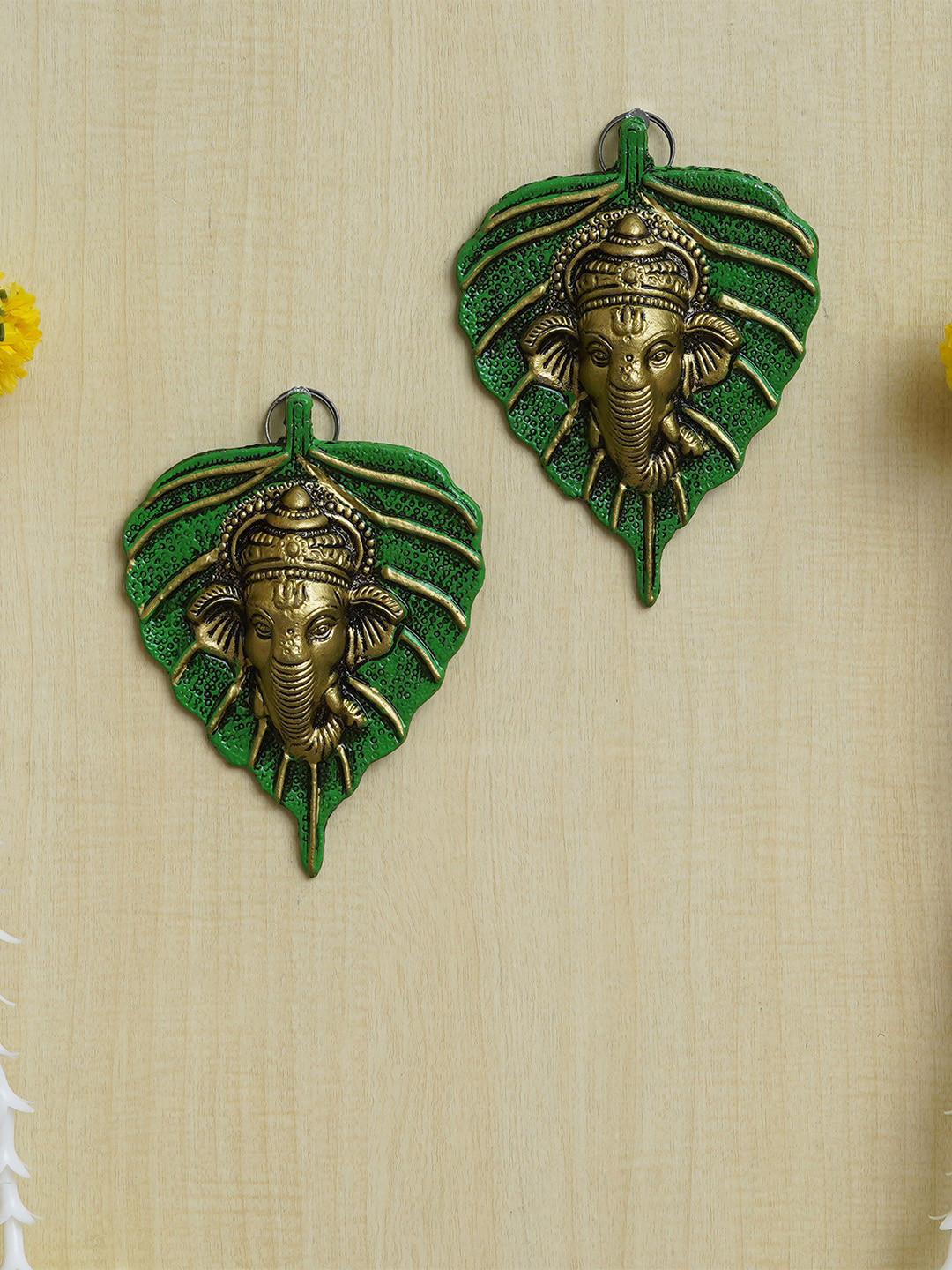 eCraftIndia Green & Golden 2 Pieces Lord Ganesha Face On Peepal Leaf Wall Hangings