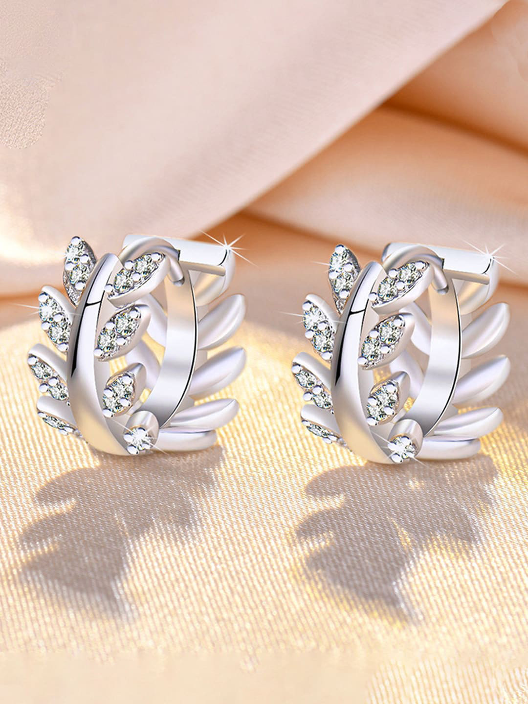 Jewels Galaxy Silver-Plated American Diamond-Studded Leaf Shape Hoop Earrings