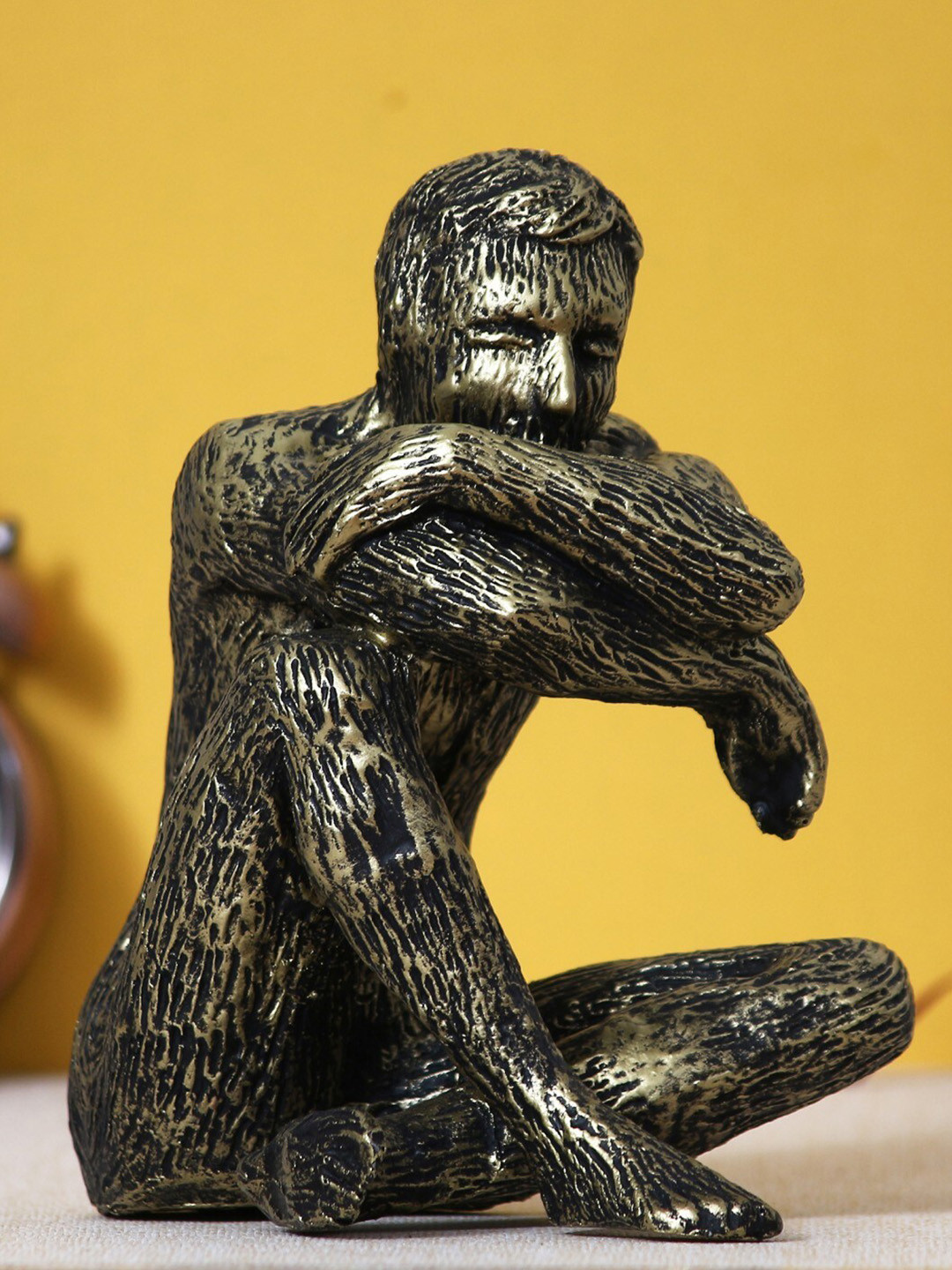 eCraftIndia Golden Man Sitting in Thinking Position Decorative Figurine Showpiece