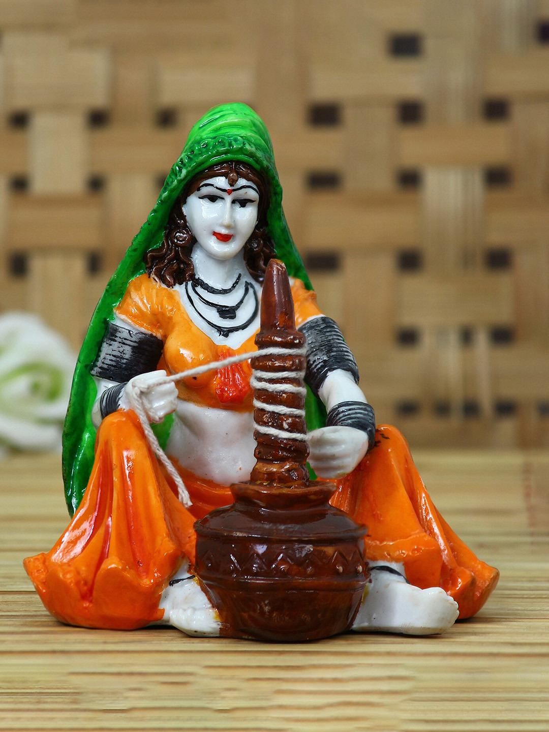 eCraftIndia Rajasthani Lady Using Makhan Handi Orange Polyresin Natural Living Room Hand-Crafted Small Showpiece - 6 Inches