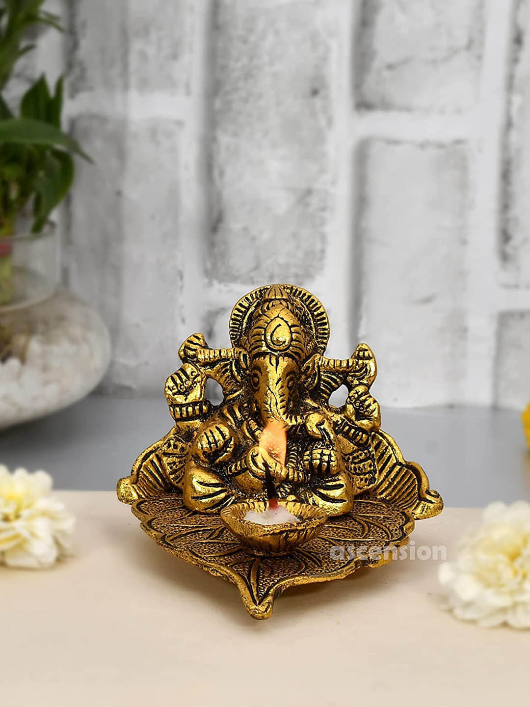 Ascension Leaf Lord Ganesha with Diya Gold Metal Metallic Prayer Room Medium Showpiece - 3.5 Inches