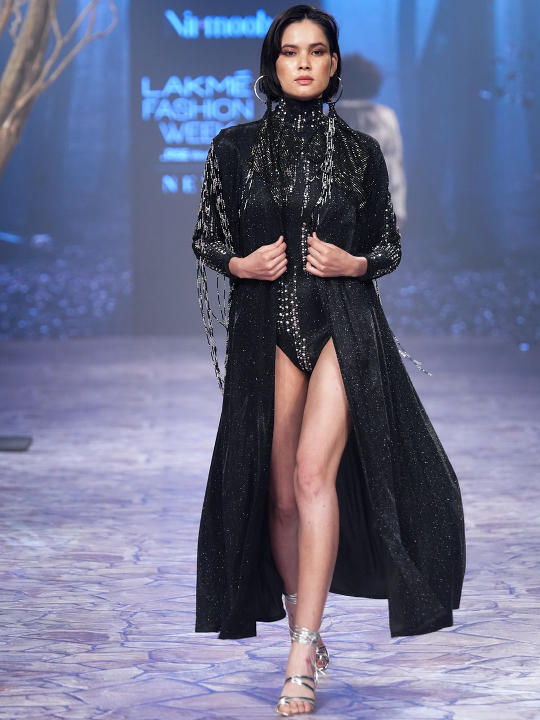 NIRMOOHA Shimmer Sleeveless Cape With Hand Embroidered Tassels