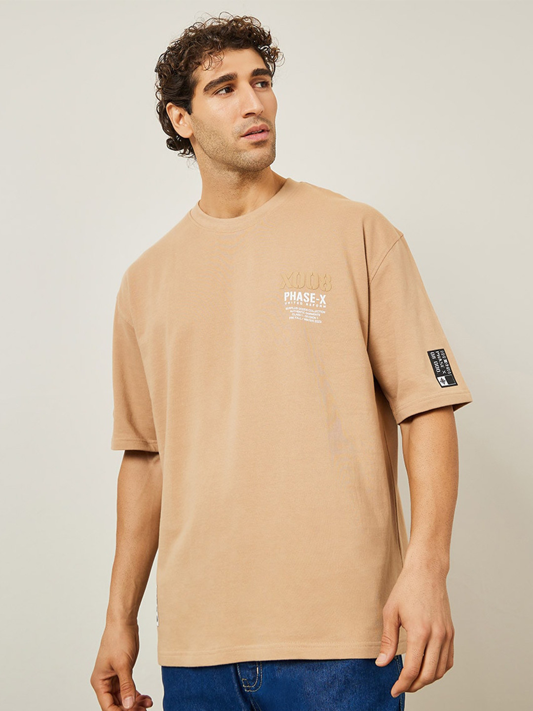 Styli Beige Typography Printed Round Neck Terry Cotton Oversized T-shirt with Woven Badge