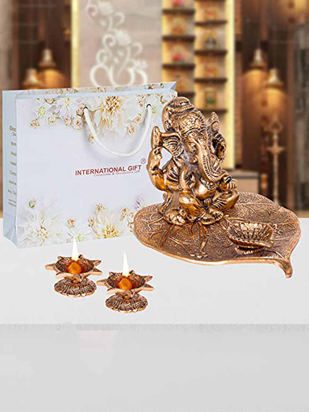 INTERNATIONAL GIFT Gold Toned Leaf Ganesh God Idol Statue With Jyot Home gift Set