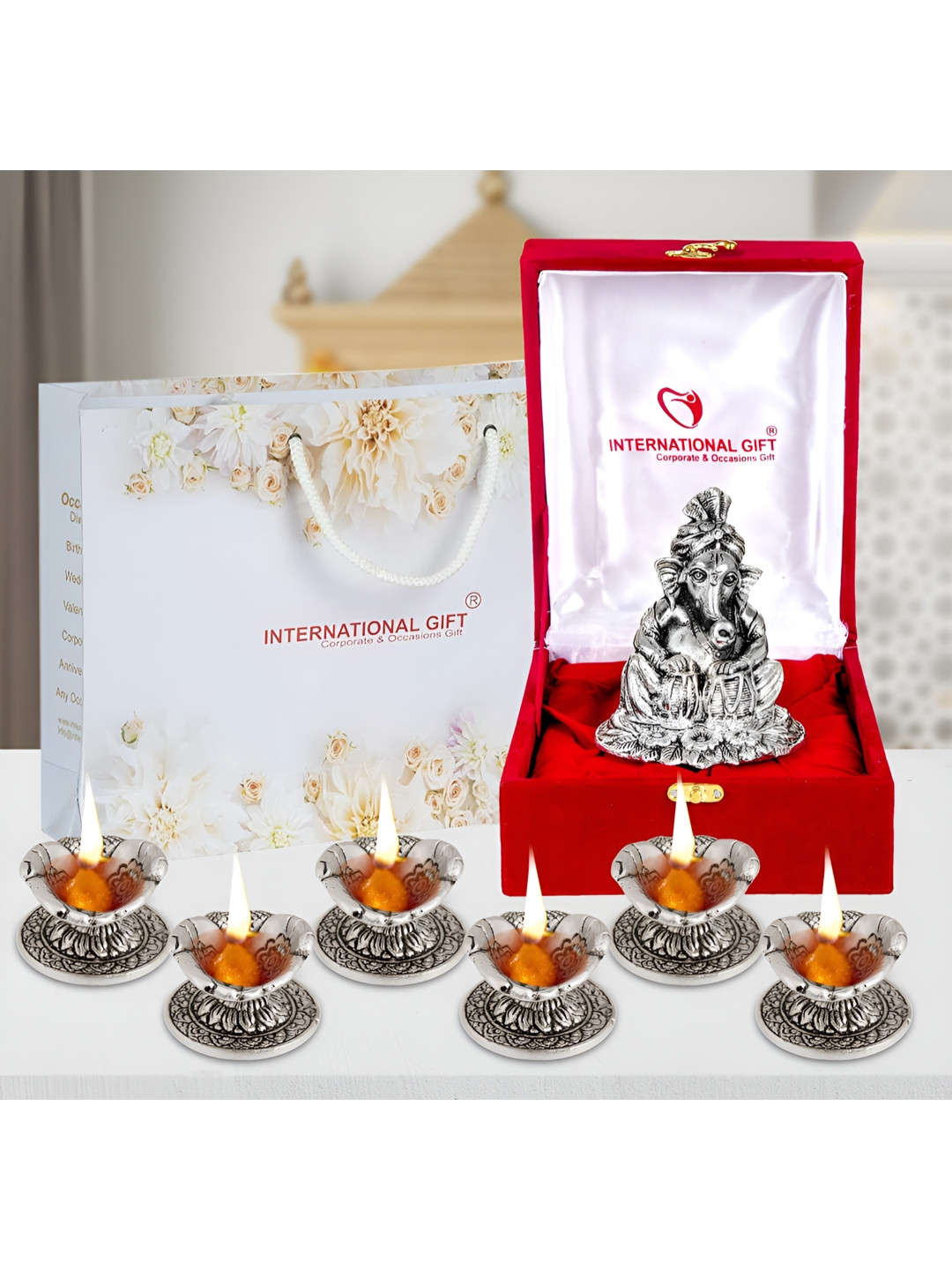 INTERNATIONAL GIFT Silver Toned 7 Pieces Lord Ganesh & Tabla Idol With Diyas Home Gift Set