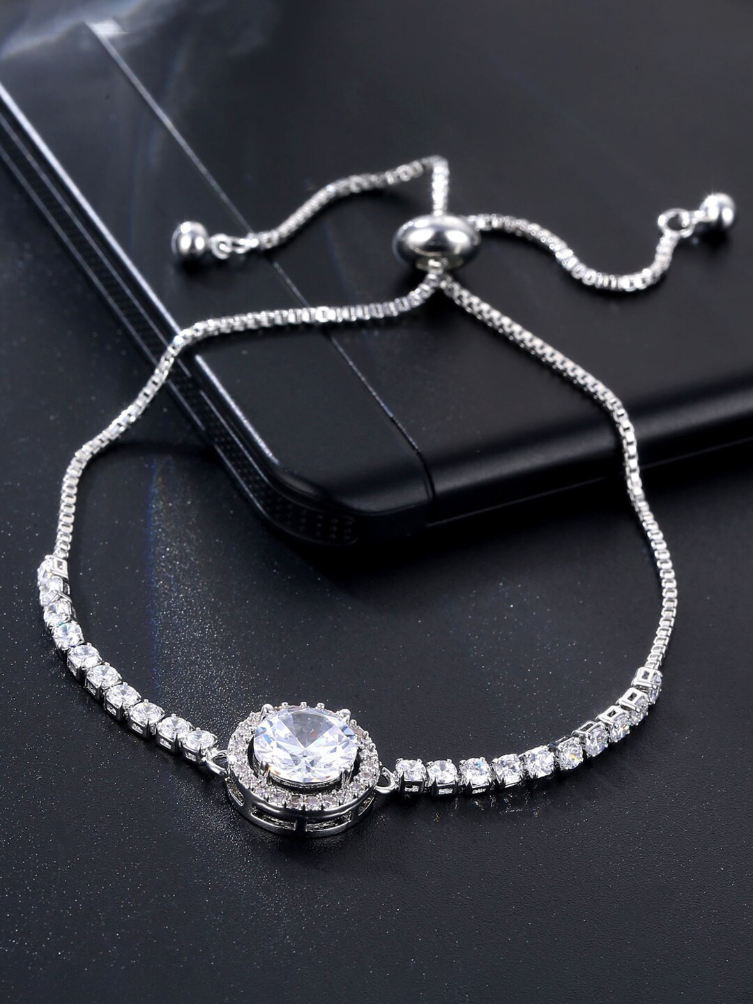 Jewels Galaxy Silver Plated Round Crystal Studded Matrix Tennis Bracelet