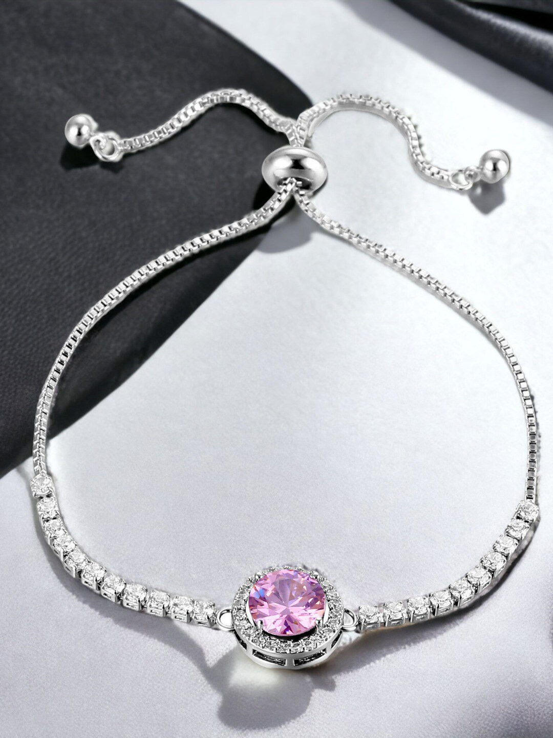 Jewels Galaxy Silver Plated Round Crystal Studded Matrix Tennis Bracelet
