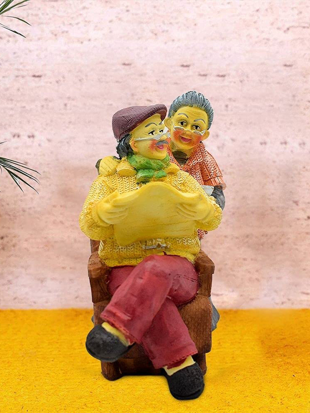 PujaNPujari Dada Dadi Yellow Resin Matte Living Room Small Showpiece - 6.3 Inches