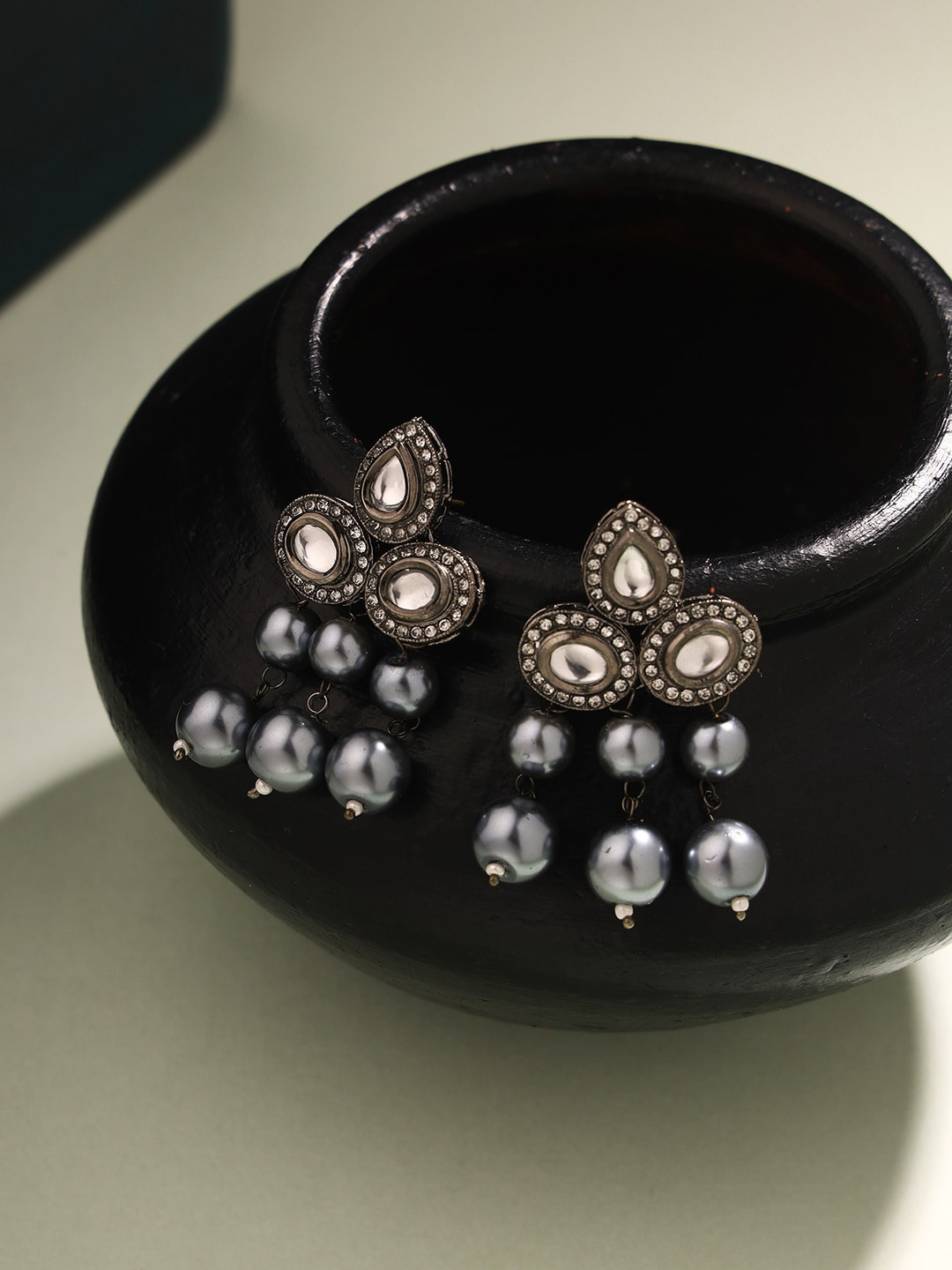 Priyaasi Black Silver-Plated Kundan Studded Contemporary Studs Earrings