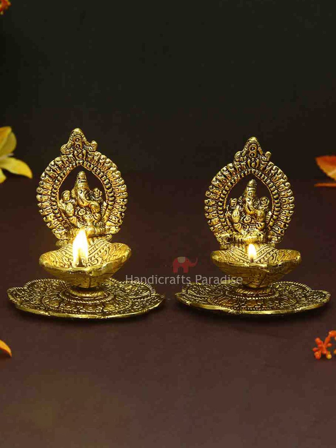 HANDICRAFTS PARADISE Gold Toned 2 Pcs Ganesh Diyas With Swastik Engraved