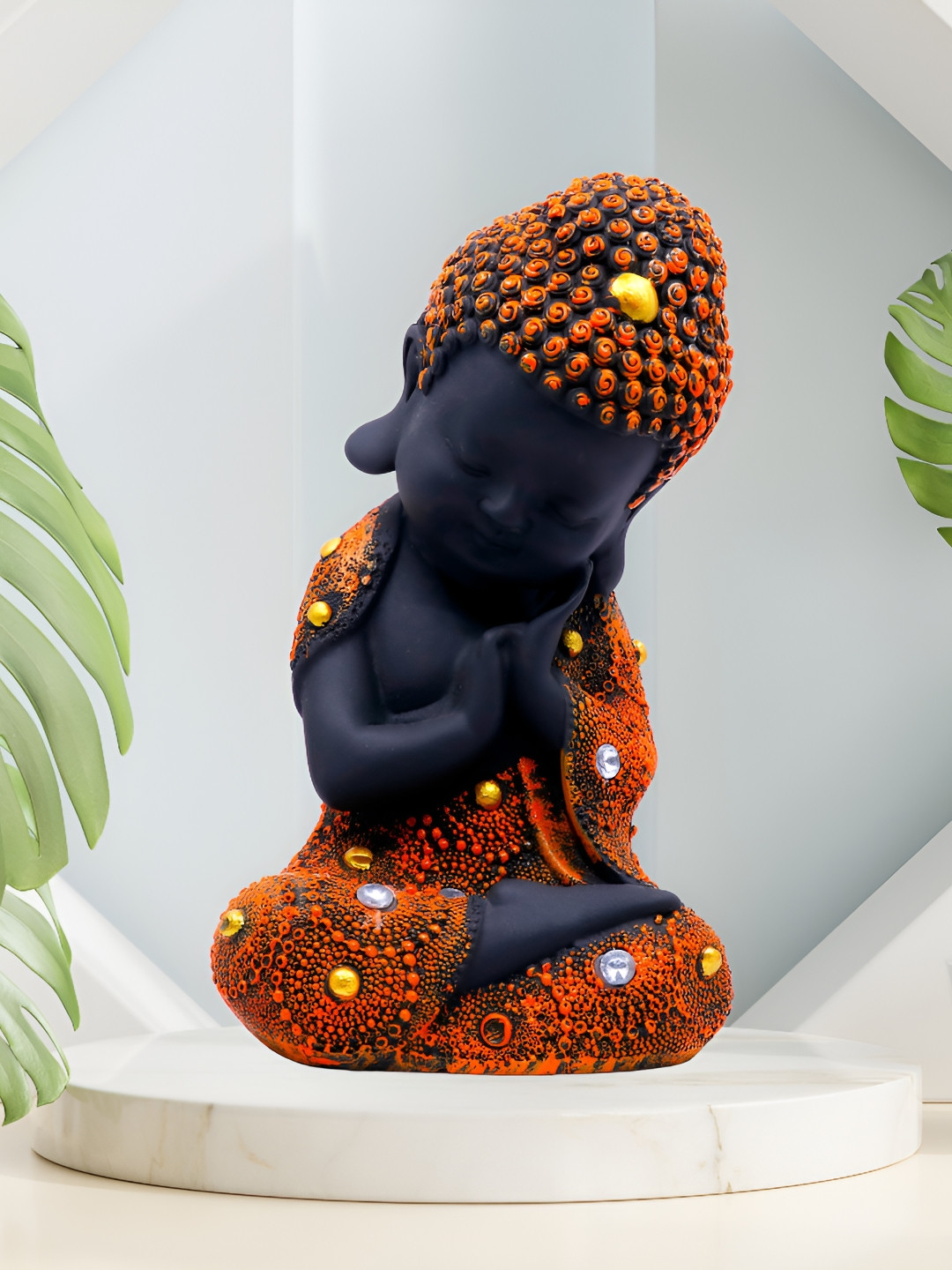 GW CREATIONS Meditating Position Monk Orange Polyresin Glossy Living Room Medium Showpiece - 2 Inches