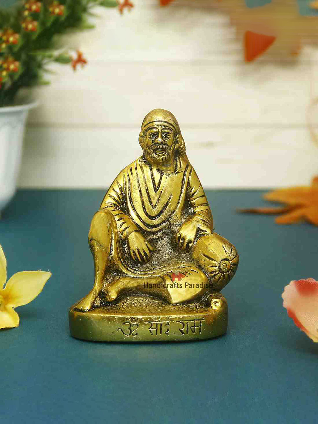 HANDICRAFTS PARADISE Sai Baba in Sitting Posture Gold Metal Metallic Prayer Room Tiny Showpiece - 4.3 Inches
