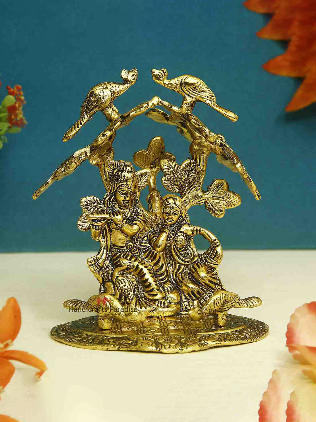 HANDICRAFTS PARADISE Radha Krishna Playing Flute Sitting Under Tree Gold Metal Metallic Prayer Room Medium Showpiece - 5.5 Inches