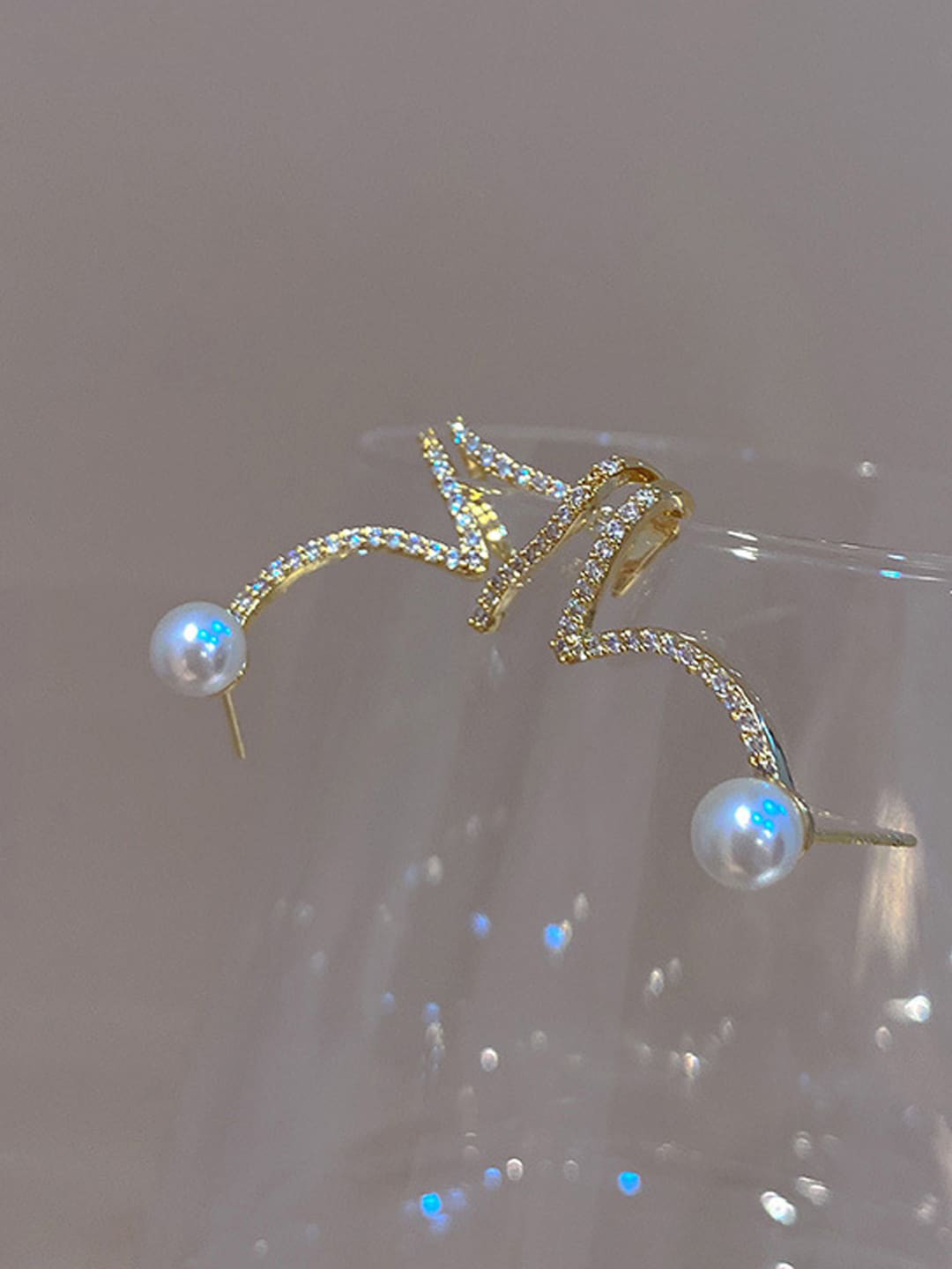 VAGHBHATT  Gold Plated Stones Studded & Beaded Twisted Snake Shape Studs Earrings