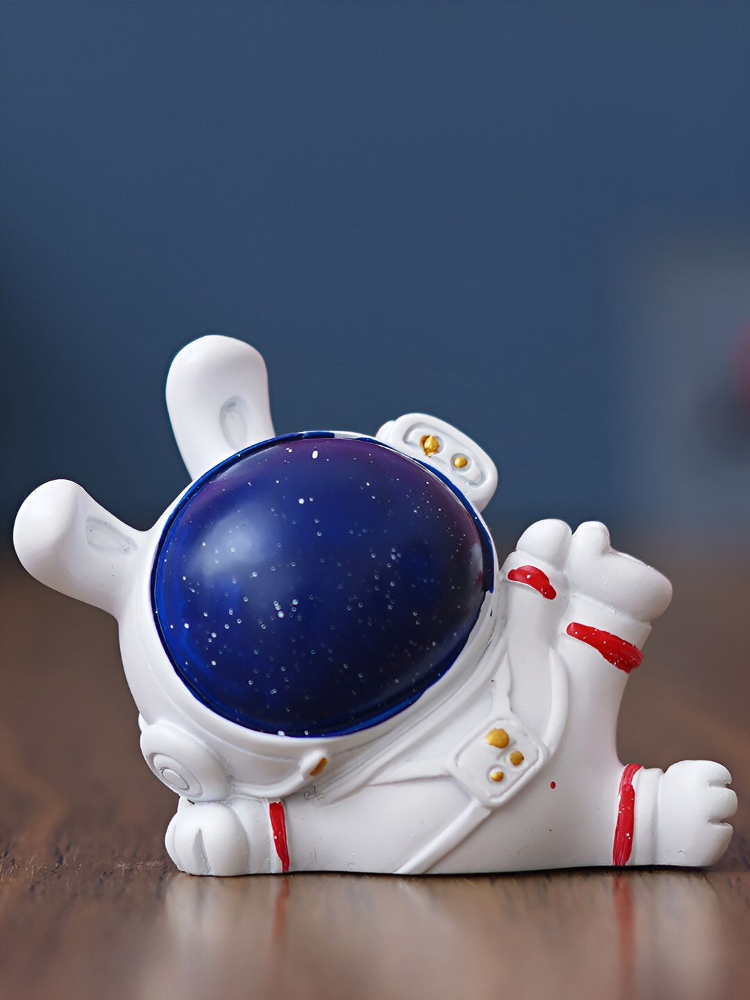 eCraftIndia Laying Sky Rabbit Astronaut Blue Polyresin Matte Living Room Medium Showpiece - 2 Inches