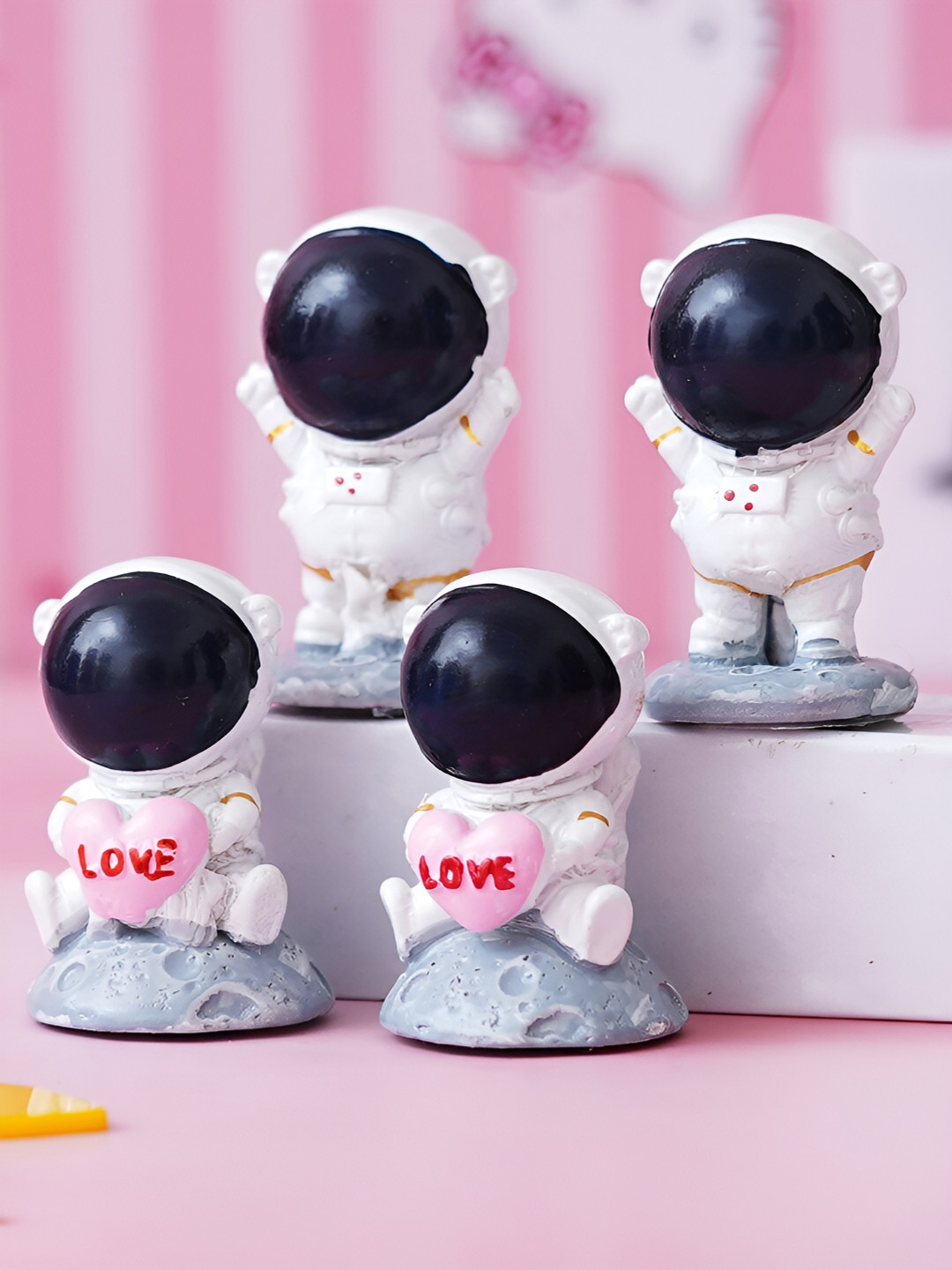 eCraftIndia Spaceman Holding Love Heart White Polyresin Matte Study Room Set of 4 Medium Showpieces - 2 Inches