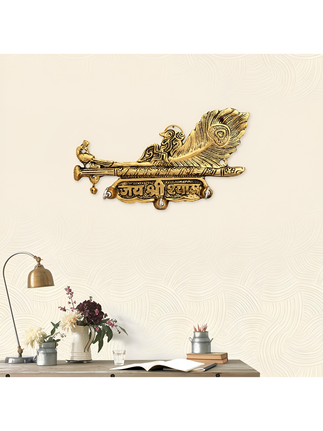 HANDICRAFTS PARADISE Gold Toned Metal Feather Shaped With Flute Key Holder